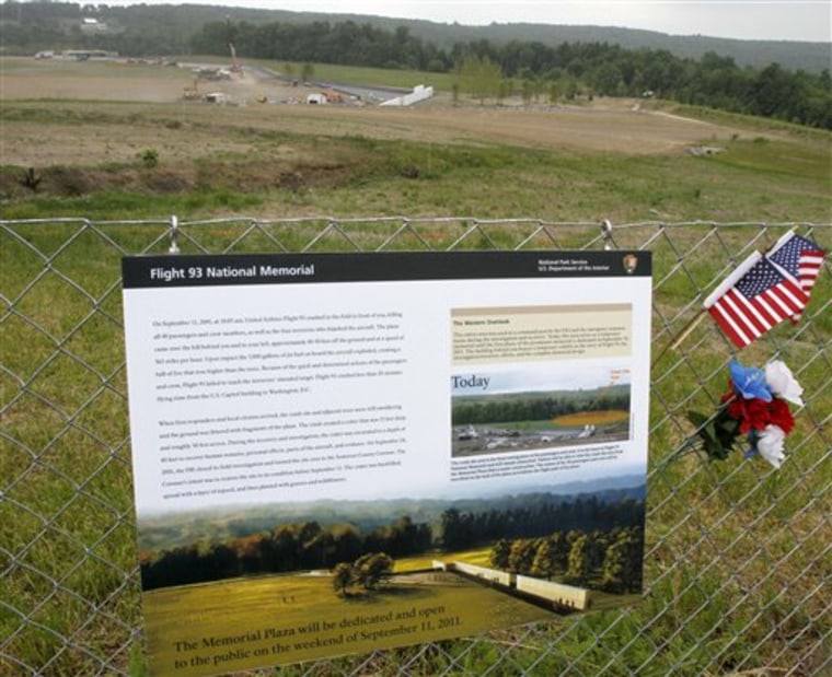 A sign describing the plan for the entire Flight 93 memorial is on the fence at the temporary memorial as construction continues at the Flight 93 Memorial. 